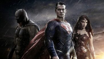 Batman, Superman and Wonder Woman standing side by side.