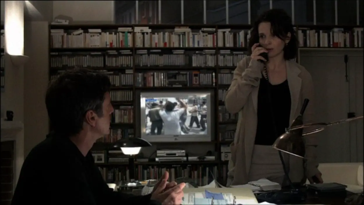 Anne (Juliette Binoche) and Georges (Daniel Auteuil) attempt to confirm by phone that their son may be missing