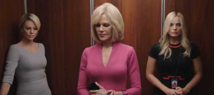 Charlize Theron, Nicole Kidman, and Margot Robbie stand in an elevator