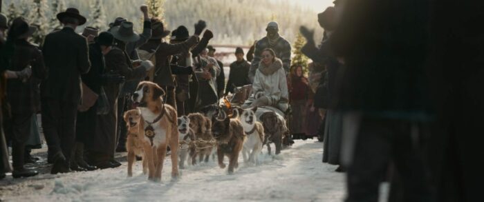 Buck and the mail sled are cheered on their arrival into town.