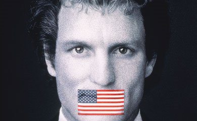 Larry Flynt with the American Flag covering his mouth
