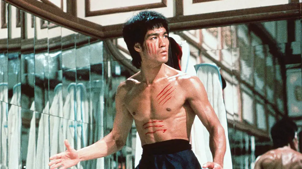 A cut-up Bruce Lee stalks his prey in a mirrored room