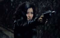 Geum-ja points her custom gun n the snow