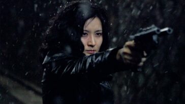 Geum-ja points her custom gun n the snow