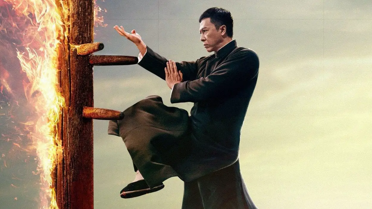 Donnie Yen spars with a flaming wooden dummy