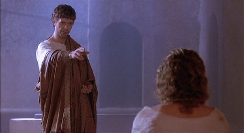 Pontius Pilate points at Jesus while they talk