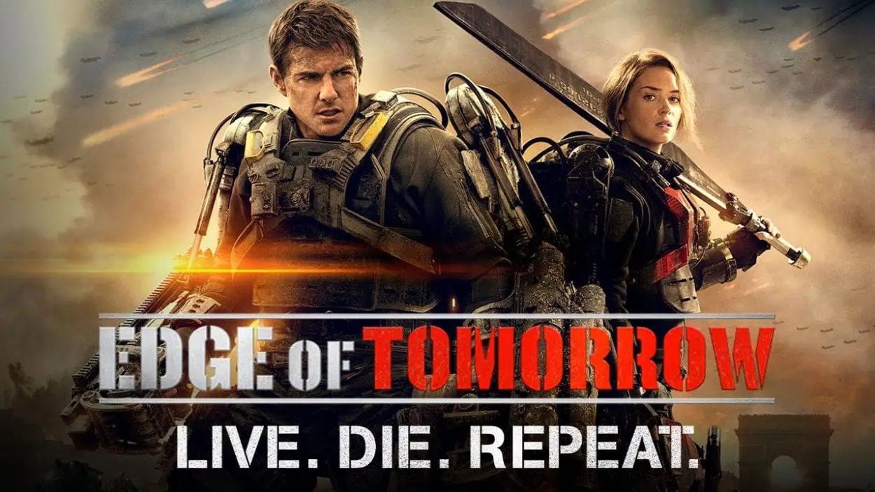 Cage and Rita stand back to back wearing exo-skeletons in Edge of Tomorrow