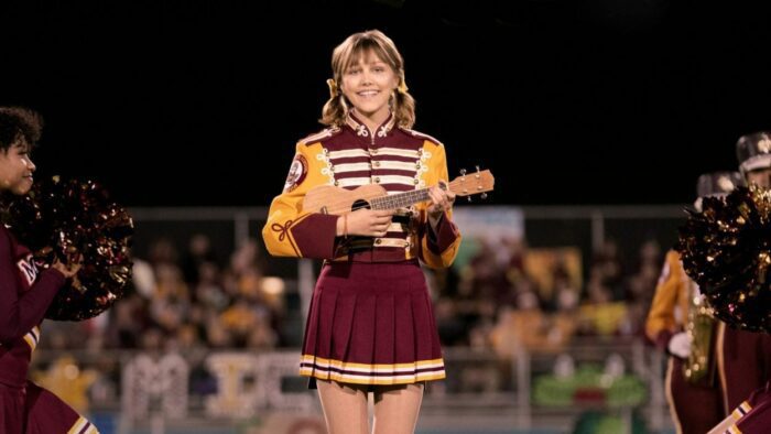 Stargirl plays her ukulele on the football field for a grand halftime performance.