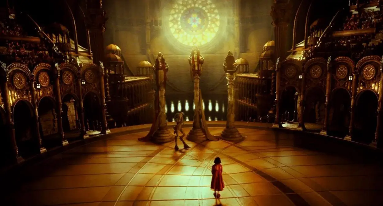Ofelia stands in a massive golden throne room