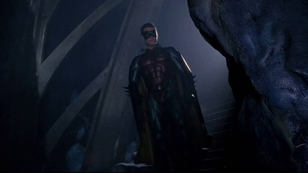 Chris O'Donnell as Robin walks down into the Batcave in Batman Forever