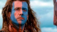 William Wallace with his face painted and hair blowing in the wind