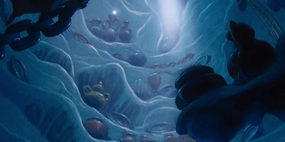 Ariel's grotto in The Little Mermaid, with a beacon of light shining from above revealing Ariel's many treasures on shelves