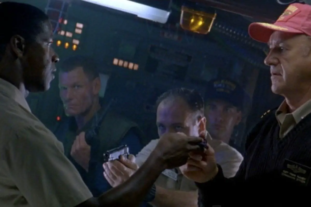 A tense standoff between Hunter and Ramsay on the USS Alabama, while Bobby Daugherty (James Gandolfini) points a gun at Hunter