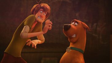 Shaggy and Scooby react in a frightened way to something in front of them