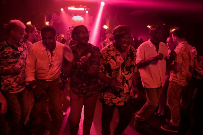 Five senior black men dance to old hits at a Vietnamese night club.