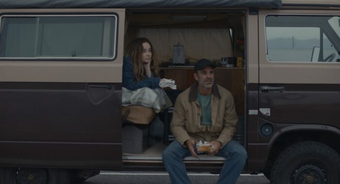 Nola and Clint share a meal on the deck of their van.