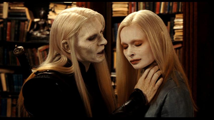Prince Nuada threathens his sister Nuala in what looks like a library