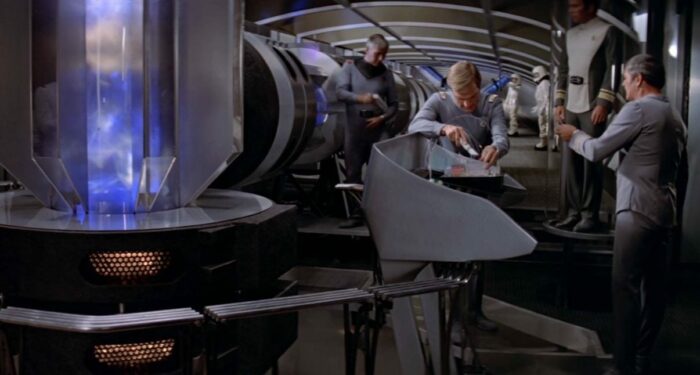 Decker and Scotty work in the Enterprise's engine room