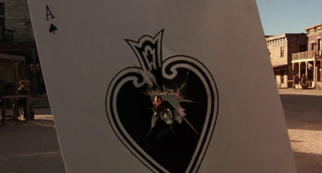 Ace can be seen through the hole in a playing card he shot through
