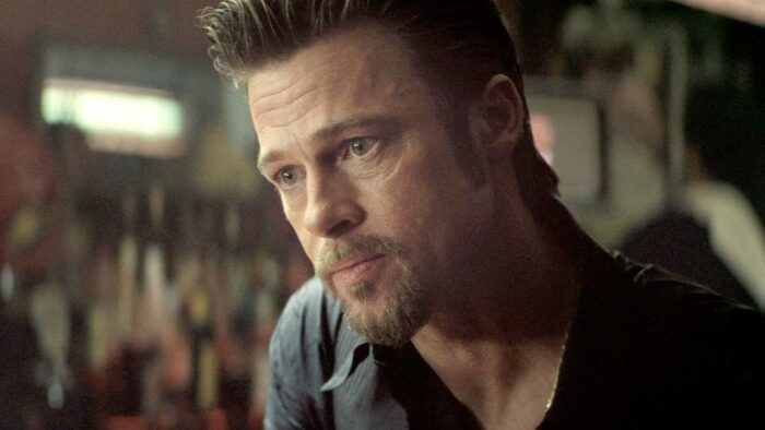 Brad Pitt leans into a bar conversation.