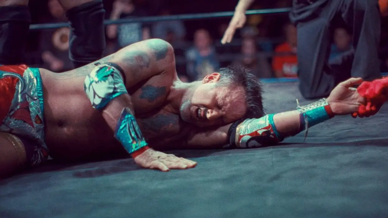 David Arquette laying in the ring, defeated.