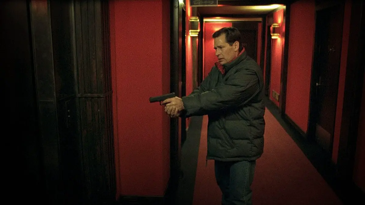 James Remar as a corrupt cop stalking a near-deserted hotel in Fear X (2003)