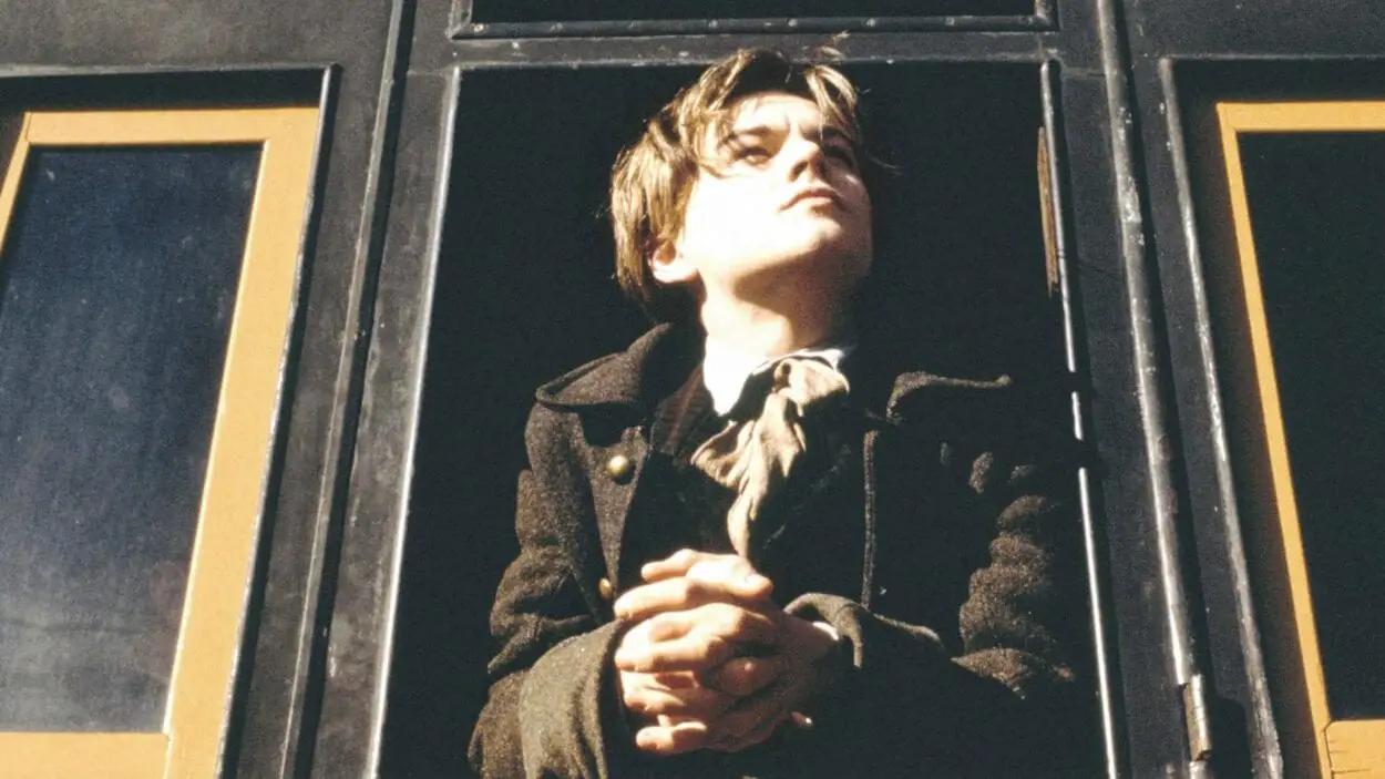 DiCaprio as Rimbaud leaning out of a train carriage