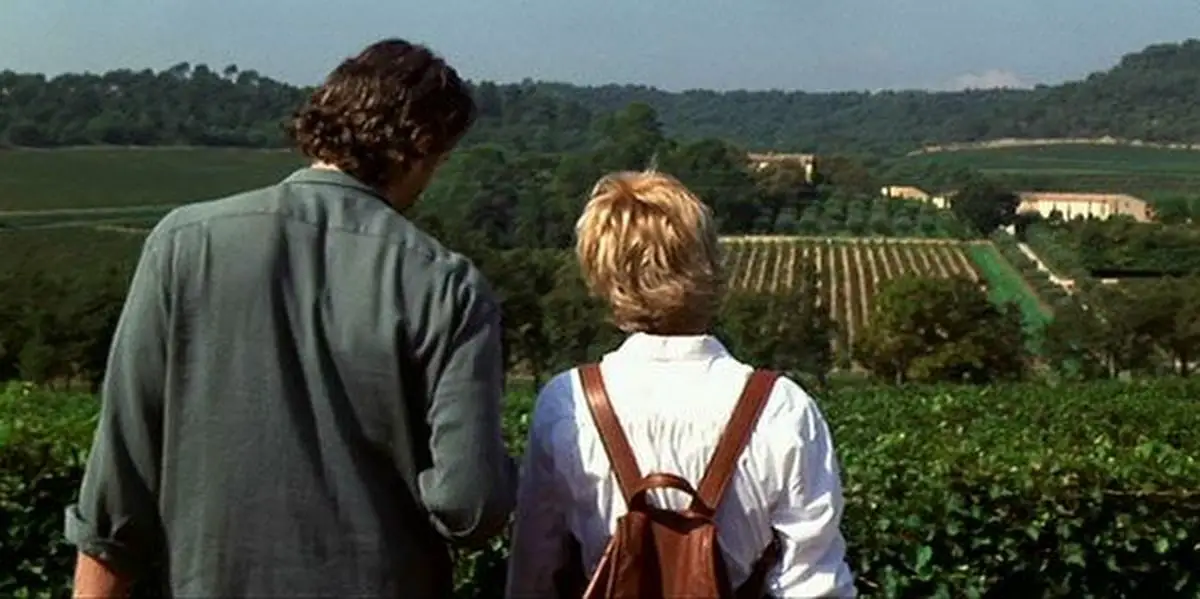 Kate and Luc in vineyard, looking over the land