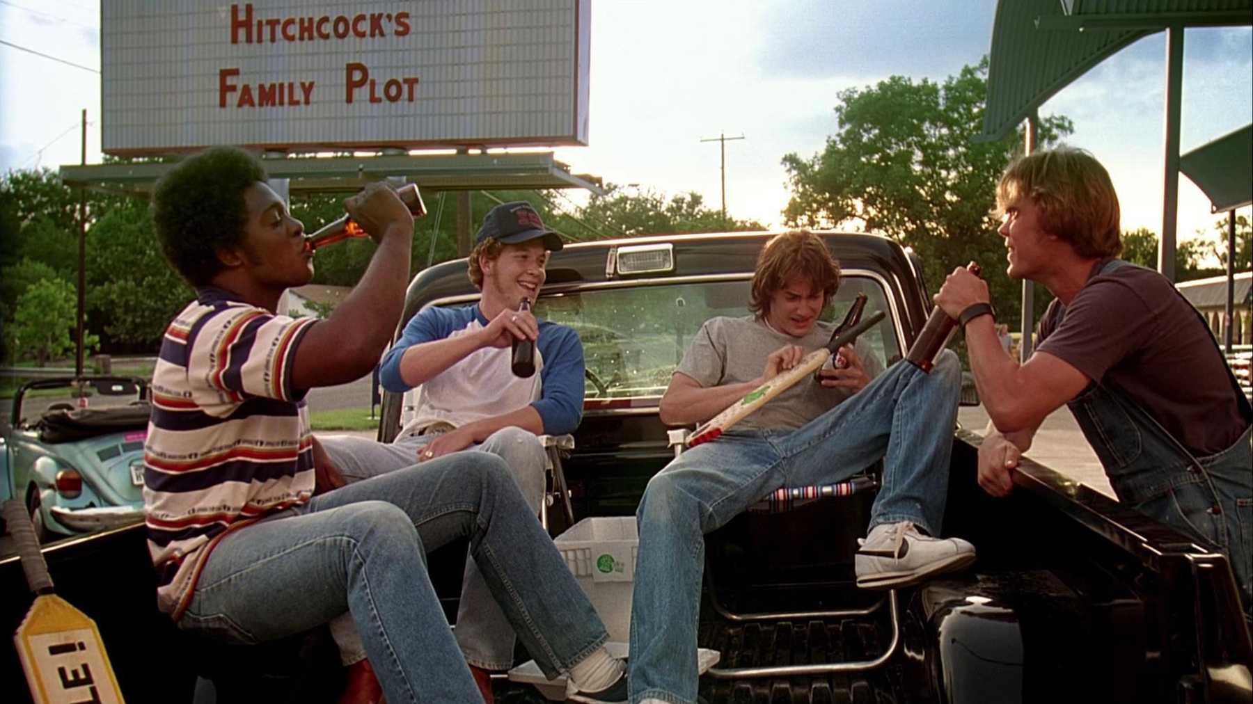 Melvin (Jason O. Smith), Benny (Cole Hauser), Pink (Jason London), and Don (Sasha Jenson) sit in the back of a pickup truck drinking beers and chatting.