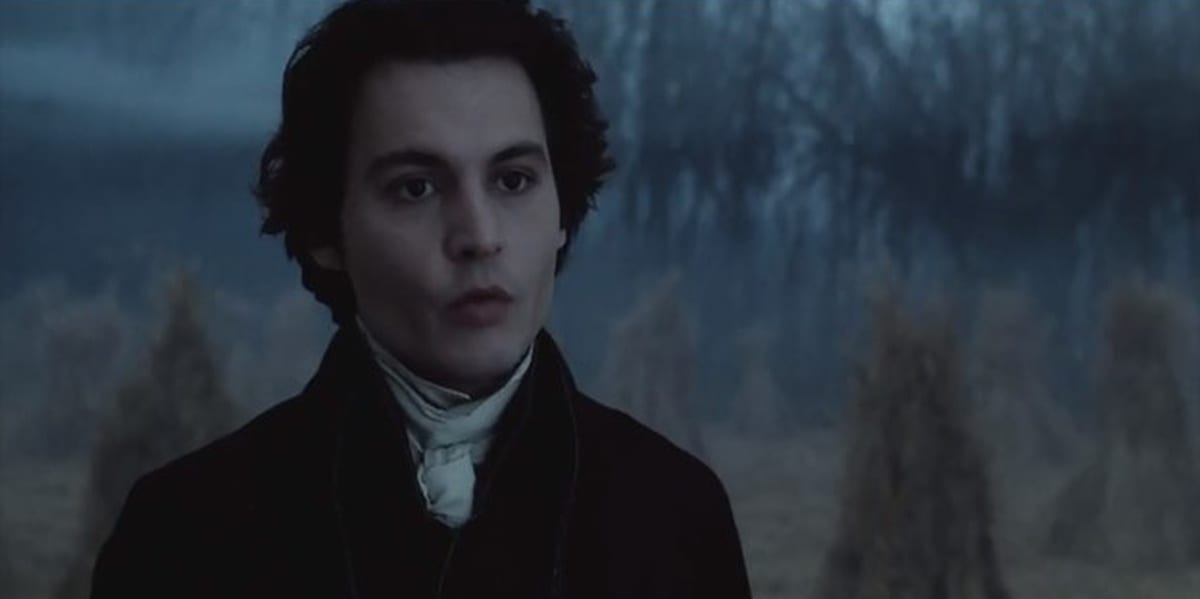 Johnny Depp in Sleepy Hollow with a foggy field in the background