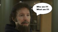 Neil Breen as Cale Altair from his film Twisted Pair. Breen is wearing a comically bad fake beard and mustache. A speech bubble says "Who am I?! What am I?!"