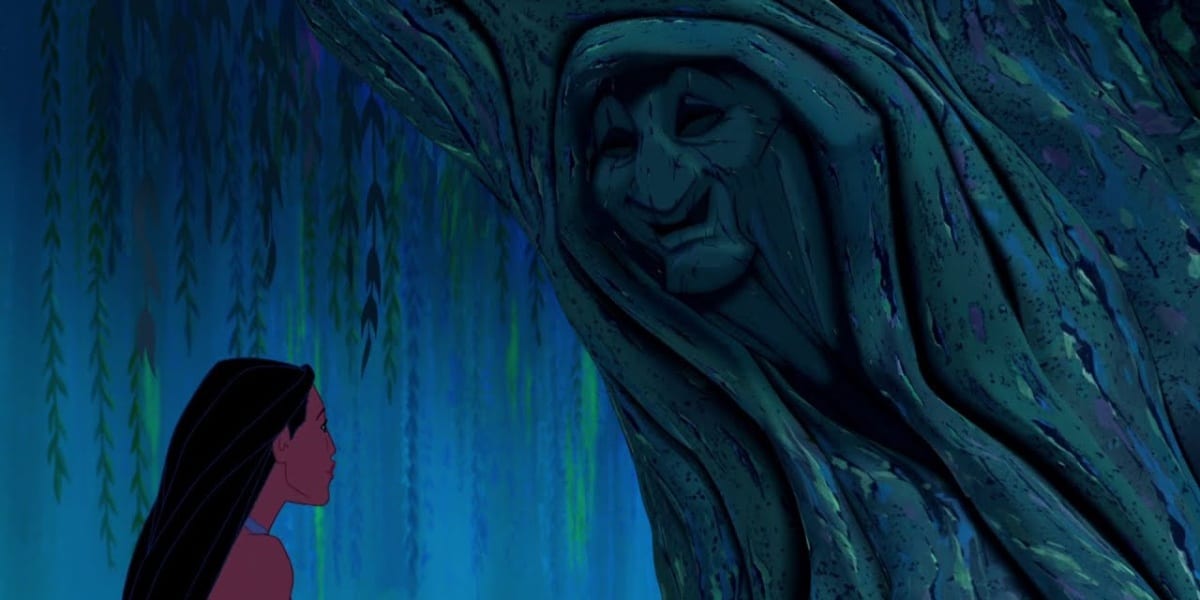Pocahontas speaking with Grandmother Willow, a face carved into a tree