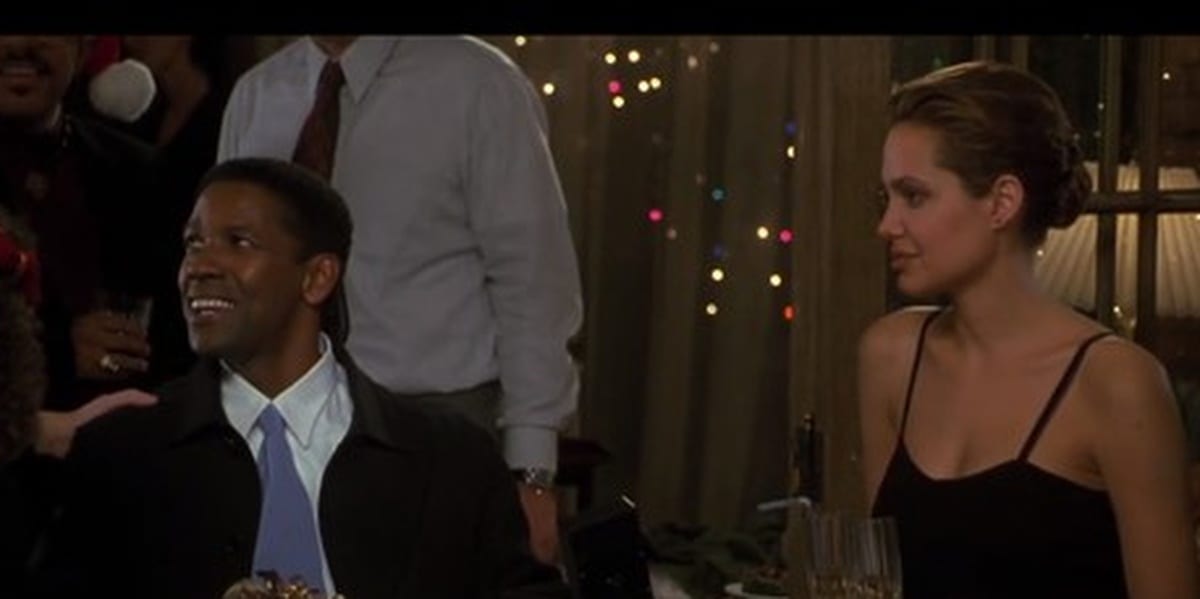 Denzel Washington and Angelina Jolie in The Bone Collector at a Christmas party