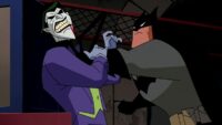 Batman chokes The Joker after he crosses the line