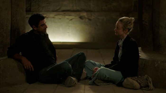 Sultan and Hana share a conversation inside a tomb.