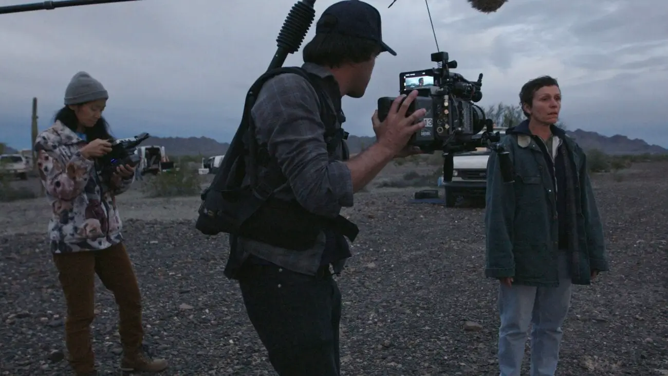 Director Chloe Zhao and cinematographer Joshua James Richards observes Frances McDormand on the set of Nomadland.