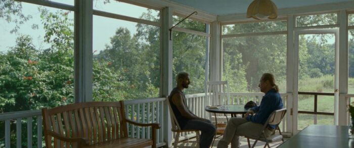 Ruben and Joe sit on a porch to talk.