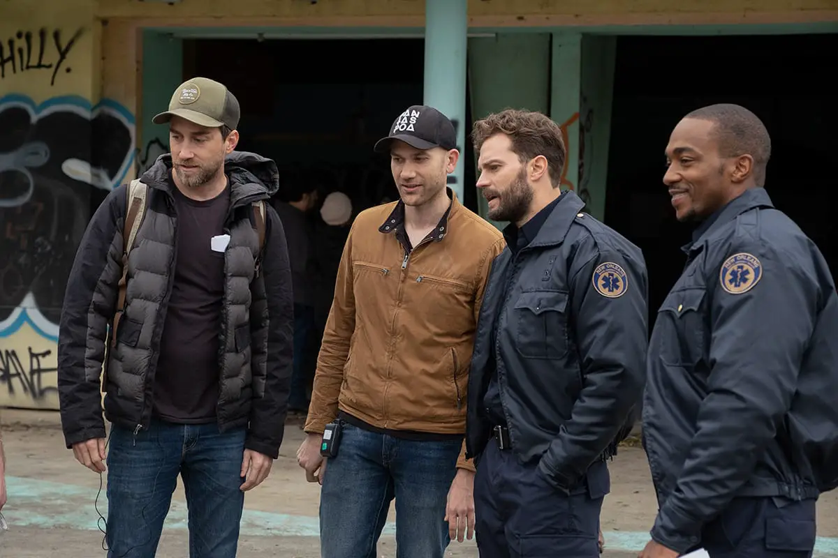 Justin Benson and Aaron Moorhead on set with Anthony Mackie, Jamie Dornan in their uniforms