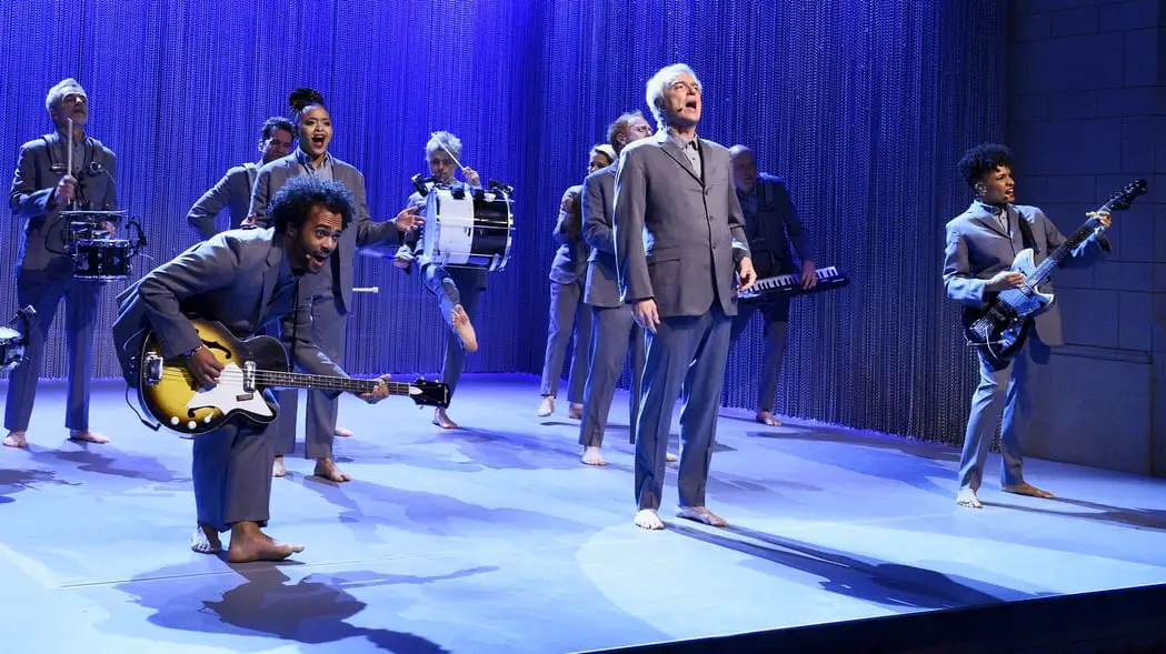 David Byrne and musicians jump up and play onstage 