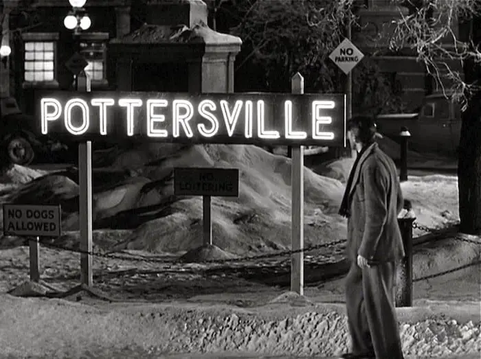 George Bailey looks at a sign for Pottersville