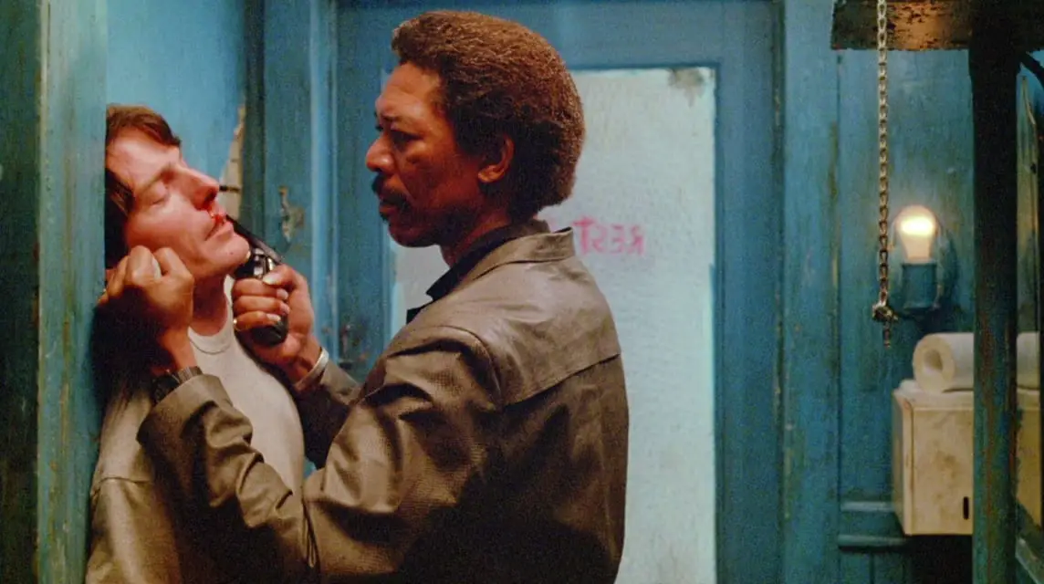 Fast Black holds a gun to Johnatan's head in a bathroom 