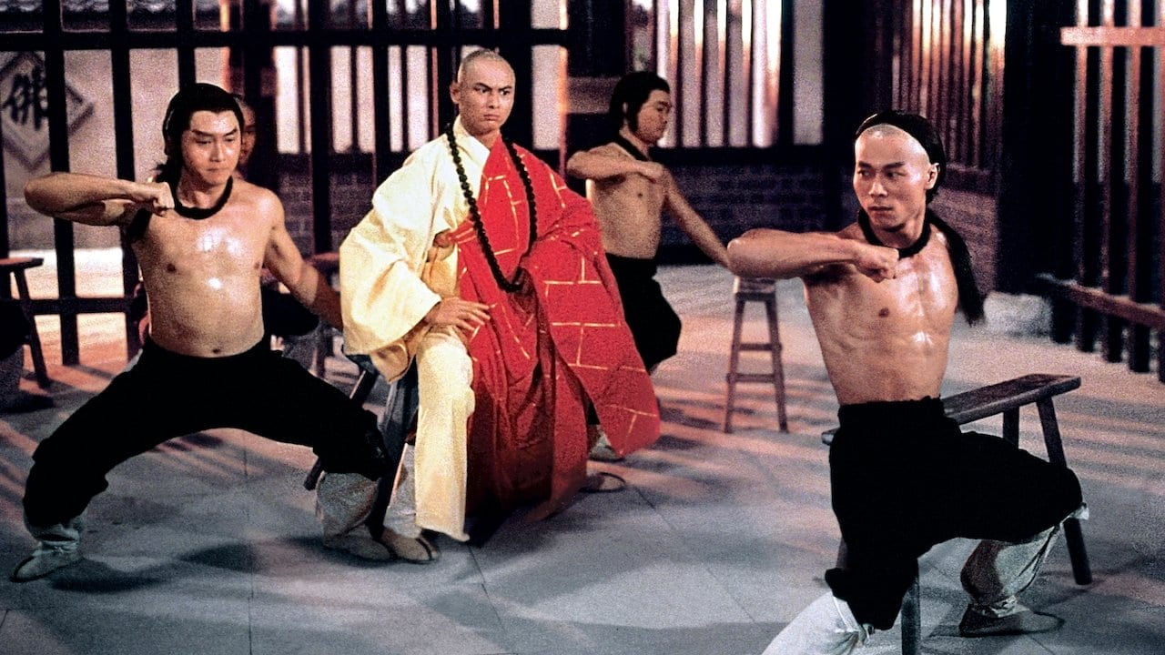 A shot from Disciples of the 36th Chamber that shows Gorden Liu training three disciples in the Shaolin way.