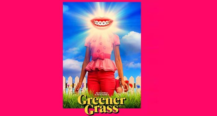 Greener Grass Poster. A woman in all pink (presumably Jill) stands in front of a picket fence in thigh-height grass. Her face is obscured by a giant gleaming smiling mouth.
