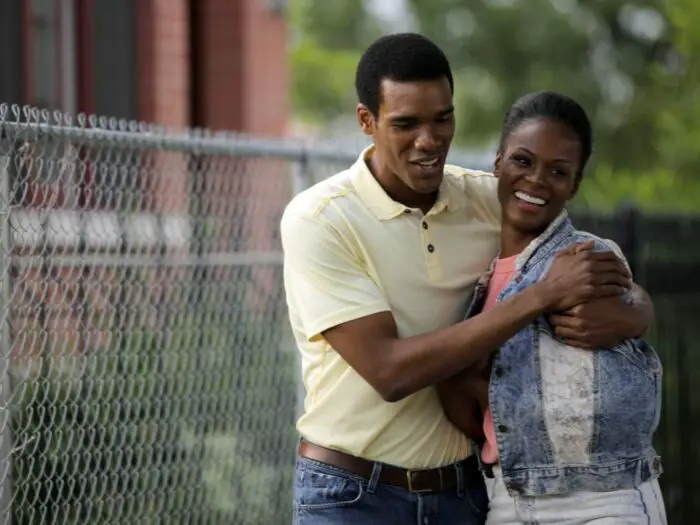 Barack hugs Michelle walking down the street.