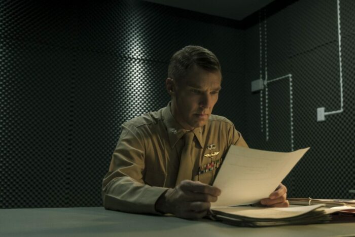 Lt. Col. Couch reads a document at a desk