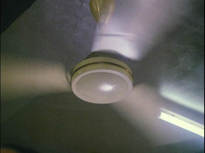 A close-up on a spinning ceiling fan.