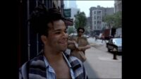 Jeffrey Wright as Jean-Michel Basquiat and Benicio del Toro as his friend, walk down the streets of New York