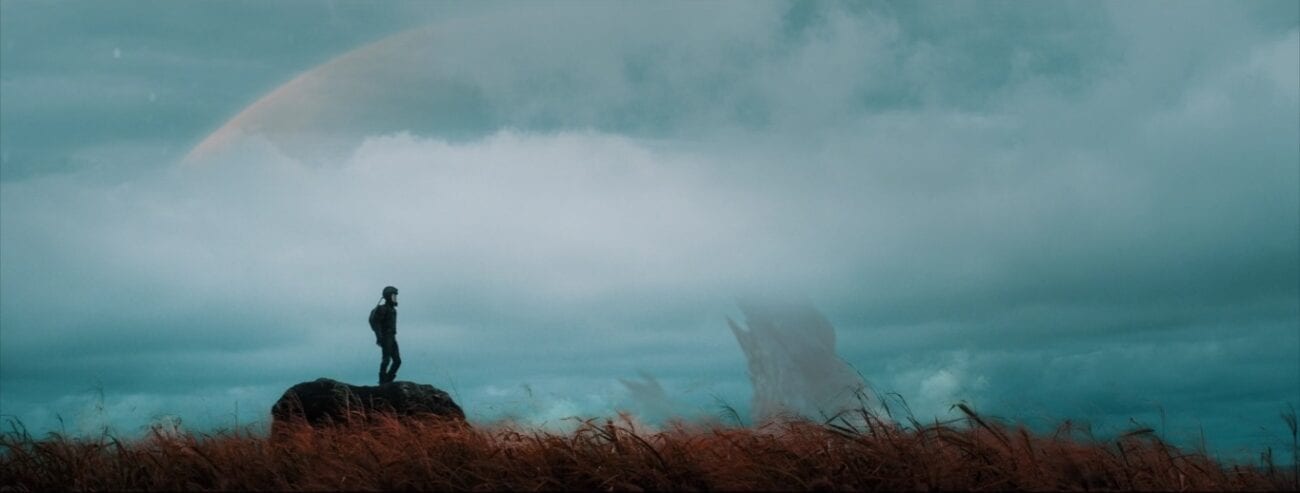 Criterion Channel Shorts March. Still from Kalewa. Kainoa Kalewa stands in a spacesuit in an alien landscape.