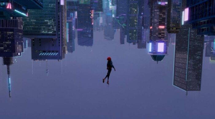Spider-Man falls downwards into the city, but the angle is reversed, so it appears he is falling upwards