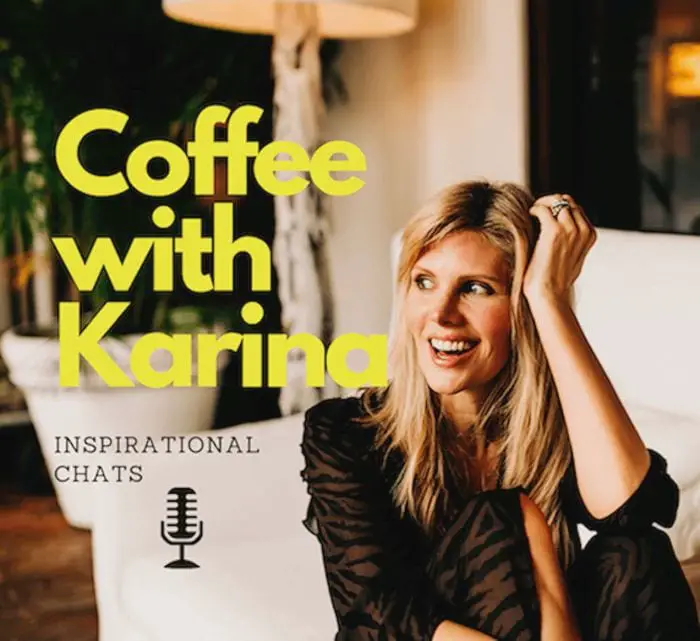 Karina Michel sits on a white sofa smiling
